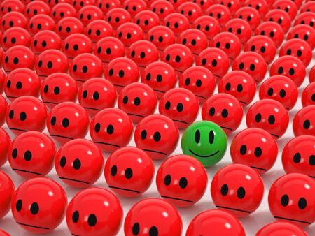 Red angry Spheres in a grid a green smiling Sphere stands outの写真素材