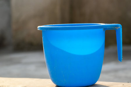 A beautiful Blue plastic bath mug with high resolutionの写真素材