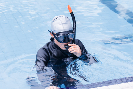 Free diving training on swimming pool