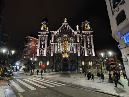 Illuminated church at night in city streetの写真素材