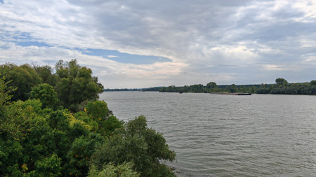 Wide river with cloudy sky