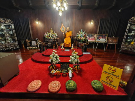 Buddhist Shrine with Monk Statue Indoorsの写真素材