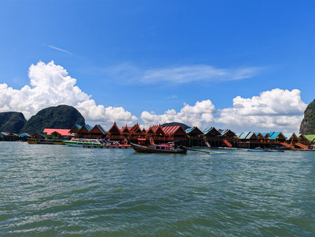Floating village with traditional houses on waterの写真素材