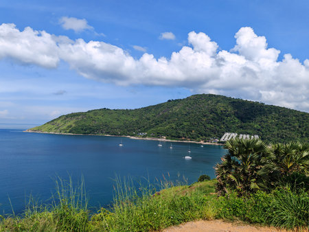 Coastal View of Green Hills and Blue Seaの写真素材
