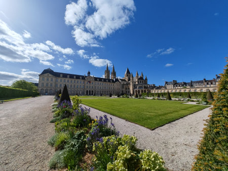 Abbaye aux Hommes view with garden path and flowers