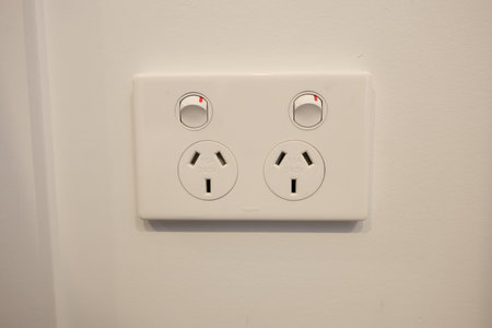 Double power outlet with switches