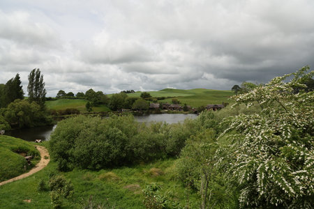 Green valley village by lake