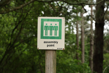 Sign Indicating Assembly Point Surrounded By Greeneryの写真素材
