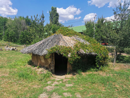 Thatched clay hut in rural countryside open air museumの写真素材