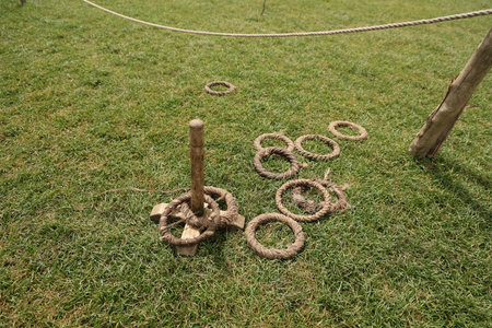 Rope ring toss game on lawnの写真素材