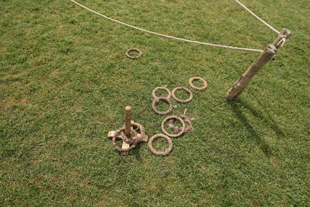Rope ring toss game on grass fieldの写真素材