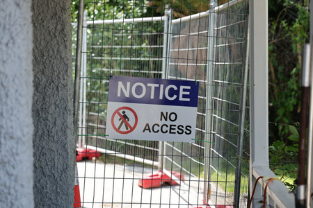 Construction Barrier Notice Sign Blocking Pathwayの写真素材