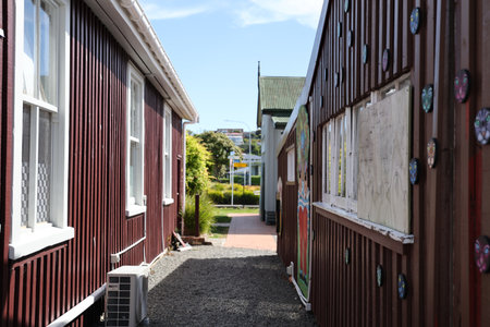 Narrow Alley Between Red Wooden Art Buildingsの写真素材