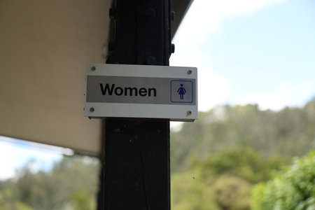 Outdoor Restroom Directional Plate Mounted Postの写真素材