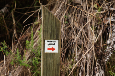 Wooden Trail Marker Indicates Waterfall Viewing Directionの写真素材