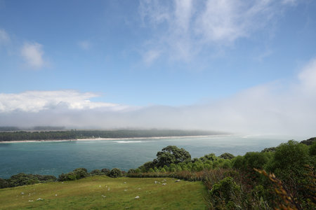 Coastal Headland Overlooking Misty Ocean Horizon