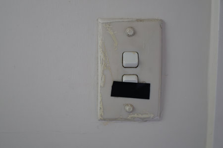 Old Double Light Switch Covered Tapeの写真素材