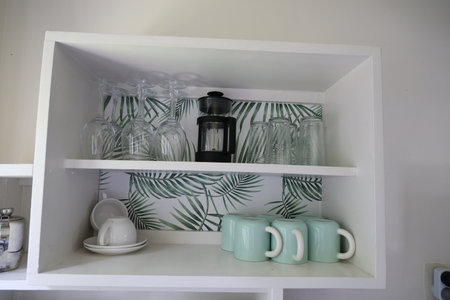Organized Kitchen Shelf Glassware Mugsの写真素材
