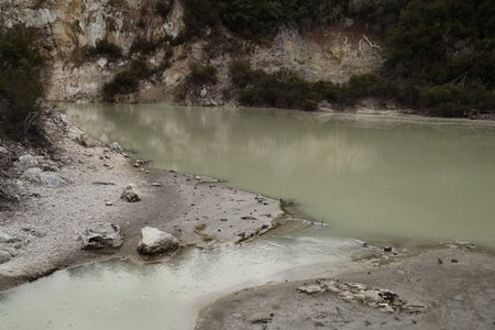 Waiotapu Thermal Wonderland Muddy Riverbank Beside Steep Rocky Cliff