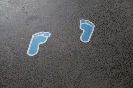 Blue Footprint Stickers Indicating Walking Directionの写真素材