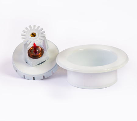 White pendent sprinkler nozzle with escutcheon on whiteの写真素材