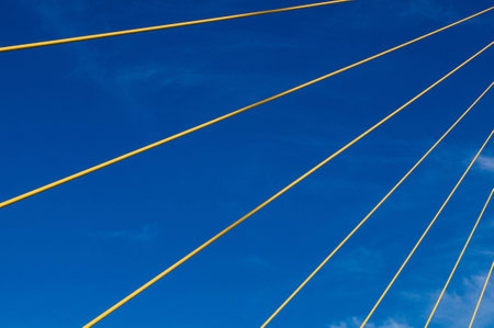 Yellow cables with clear blue sky,Rama 8 bridge,Bangkok,Thailandの写真素材