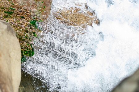 Waterfall from ravine.waterfall from the mountain river. rapid currentの写真素材