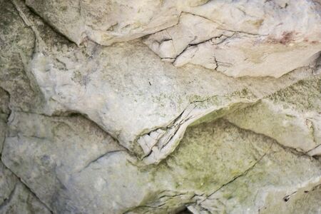 A close up of the surface of the grey stone.