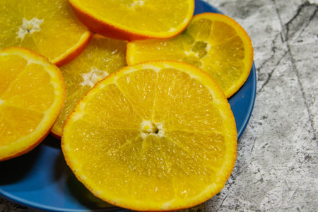 Abstract background with citrus-fruit of orange slices. Close-up. Studio photography.