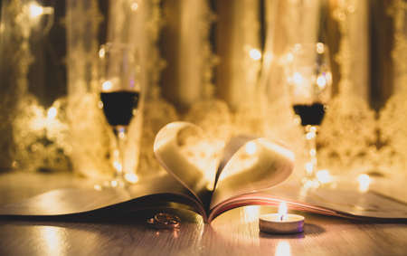 Valentine day. Book with pages in heart shape. Dark background.の写真素材