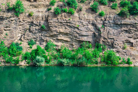 Canyon with blue water river in autumn. Selective focus.の写真素材