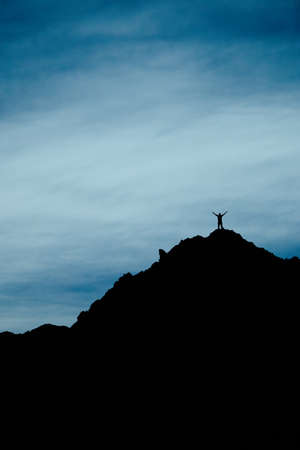 silhouette of a man standing on top of the mountain in Ladakh, India with copy spaceの写真素材