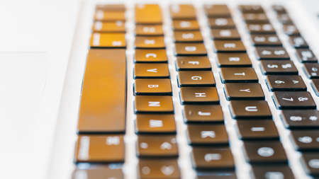 hands typing on a keyboardの写真素材