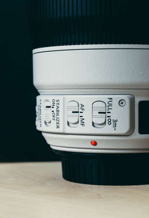 Canon telephoto zoom lens 100-400 millimeter with control switches in close up view.のeditorial素材