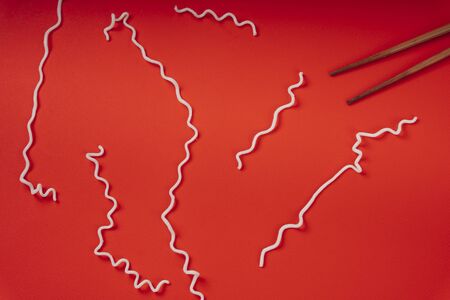 Texture of instant noodle over red background. Isolate in red. Line texture.の写真素材