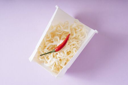 Instant noodle in a cup. Spicy flavour with chilli.