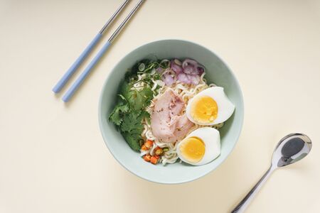 Top view - Tom Yum soup with instant noodle in the big bowl. Mama.の写真素材