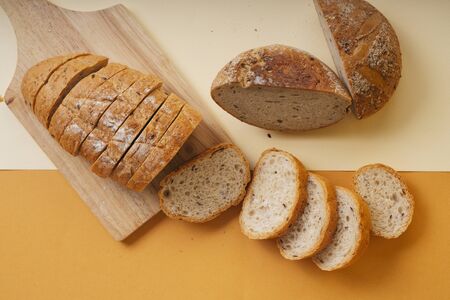 Group of many type of bread on a plate and cooking flour.