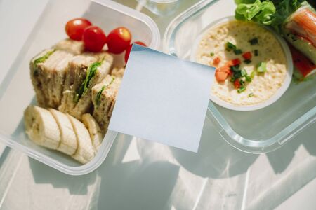 Food delivery concept. Copy space. Healthy food salad bowl and spring roll also sandwich on table.の写真素材