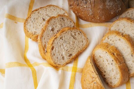 Group of many type of bread on a plate and cooking flour.