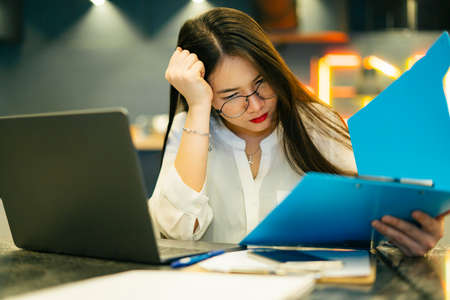 Asian woman with crying posture walking in the city.