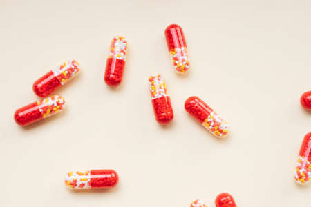 Top view - Red pill capsules and molecules as medical concept.の写真素材