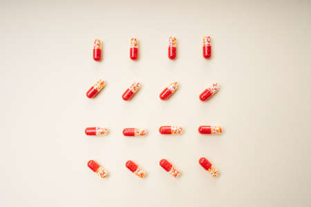 Top view - Red pill capsules and molecules as medical concept.の写真素材
