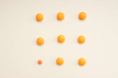 Top view - Medicine orange pills circle shape isolate over white background.の写真素材