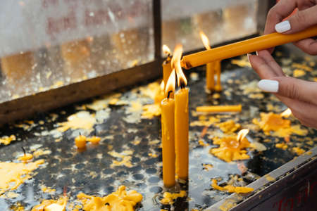 Close up shot of candles are burn by flame on themselves.の写真素材