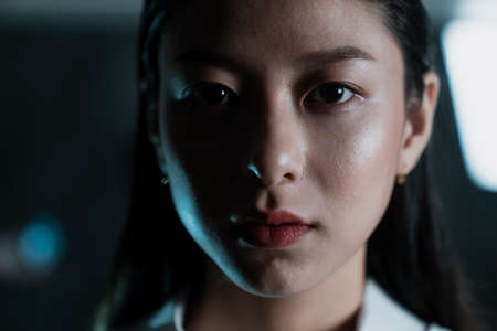 Close up shot of woman's face with strong eyesight, horizontal.の写真素材