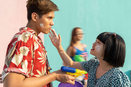 Asian thai couple playing songkran in summer vacation. Songkran in Thailand.