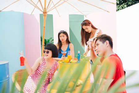 Group of people enjoy party in summer together.