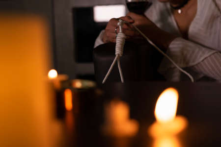 Sad business woman stress from work holding glass of wine sit in the room with hanging loop. Commit suicide.の写真素材