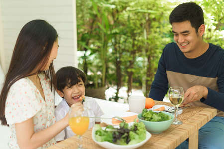 Asian thai family enjoy having healthy food for lunch or brunch together at home.